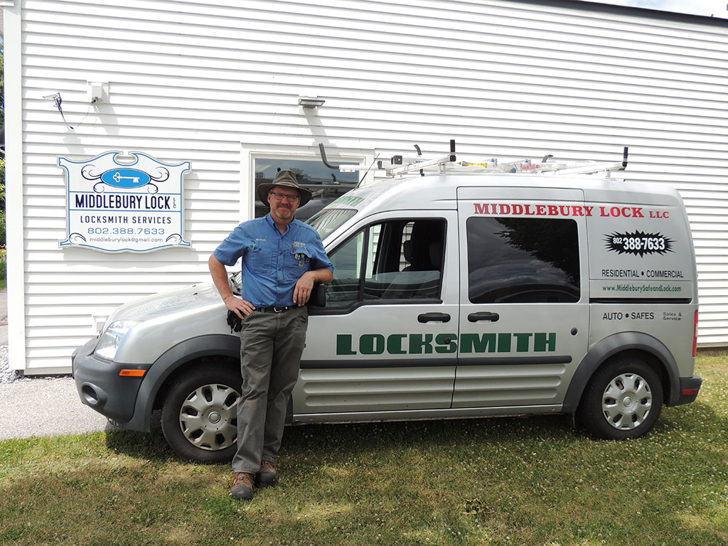 Mike standing next to the Middlebury Lock LLC service van outside the shop