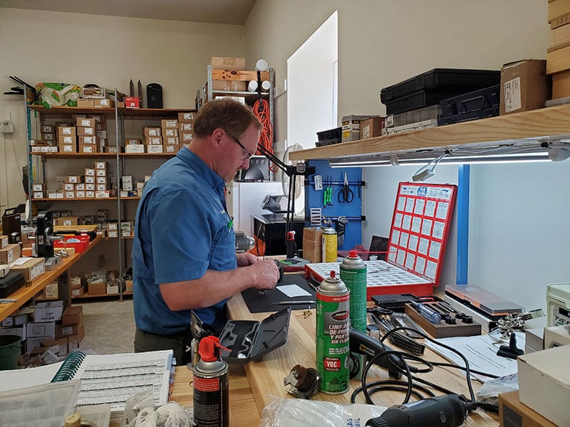 Mike working at the locksmith bench