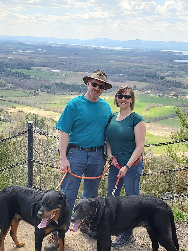 Michael and Samantha Kachmar with their dogs overlooking the Champlain Valley